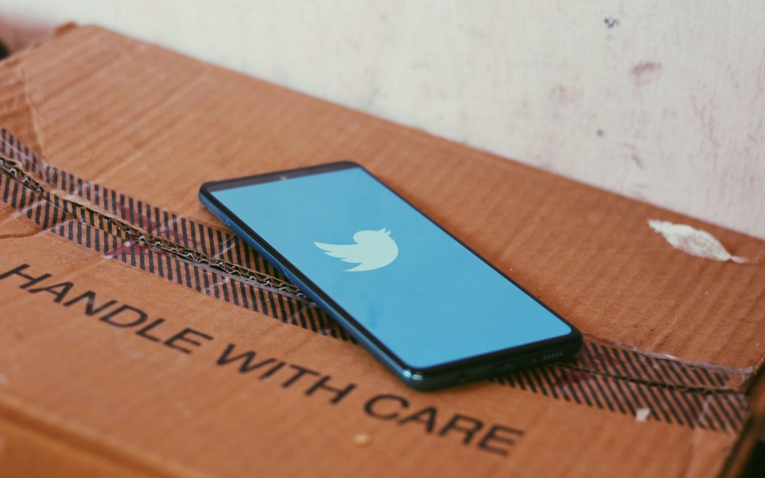 black ipad on brown wooden table